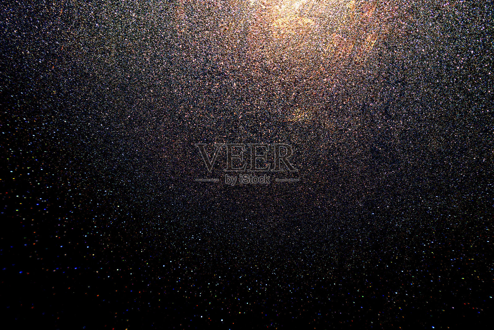 黑色，深蓝色，蓝色，金色，橙色，闪亮的抽象背景设计。闪烁发光的星星效果。奇妙的幻想。比如外太空，夜空，宇宙。颗粒，表面粗糙。照片摄影图片