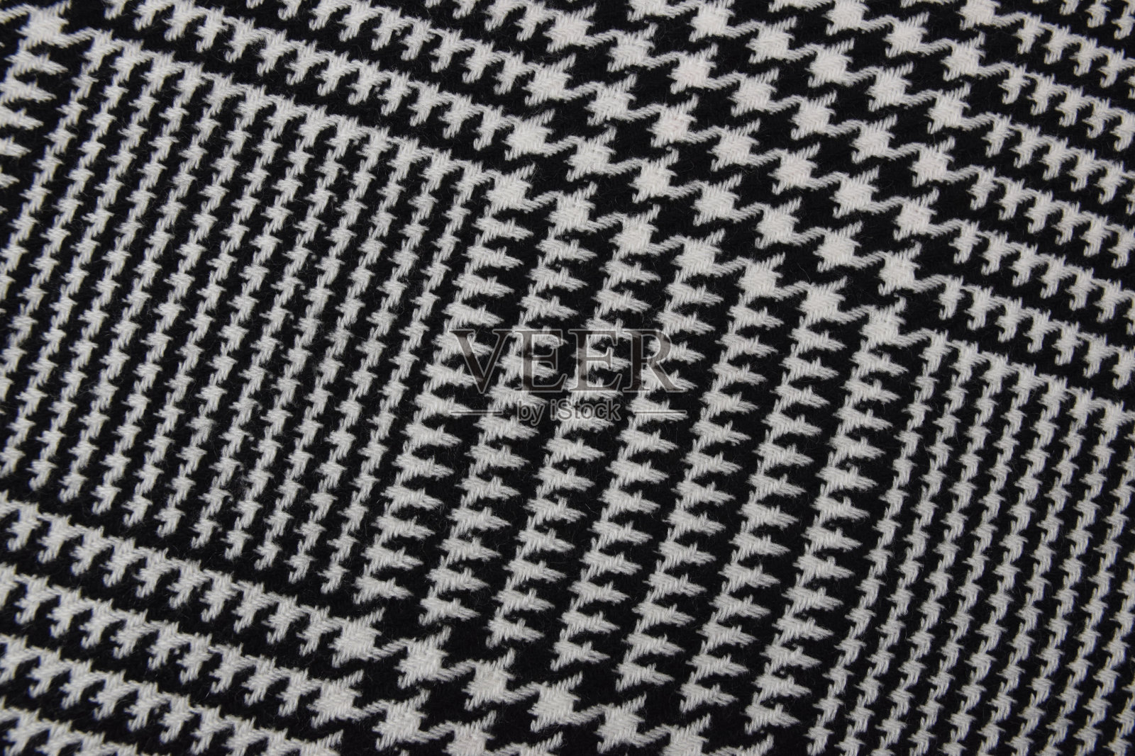 大黑色和白色的笼织物或布纺织寒冷的天气。照片摄影图片
