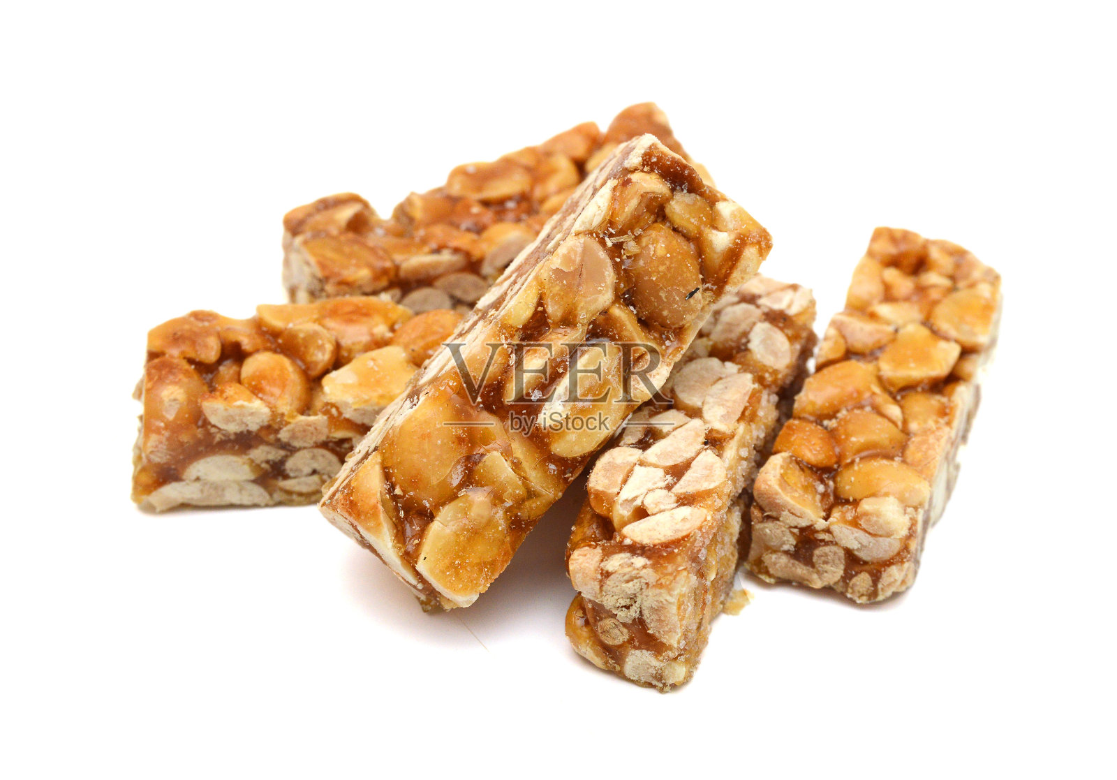 蜂蜜棒与花生，芝麻和葵花籽分离照片摄影图片