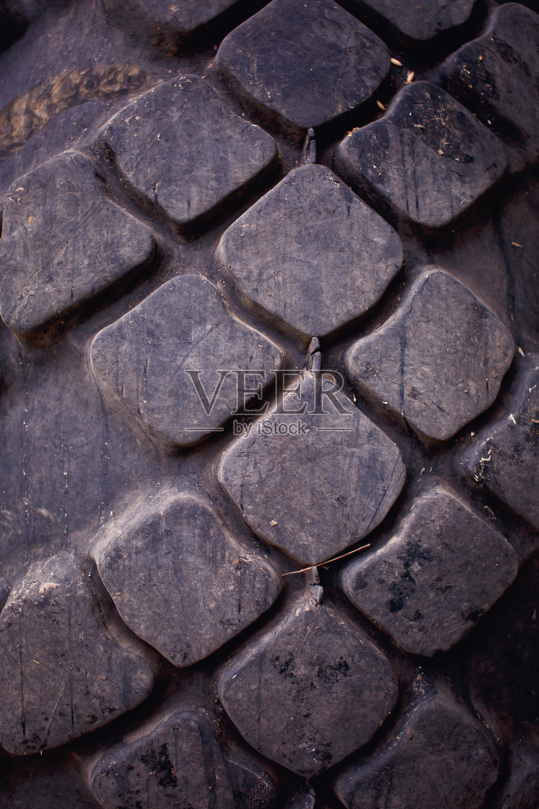 拖拉机轮胎胎面特写作为背景。照片摄影图片