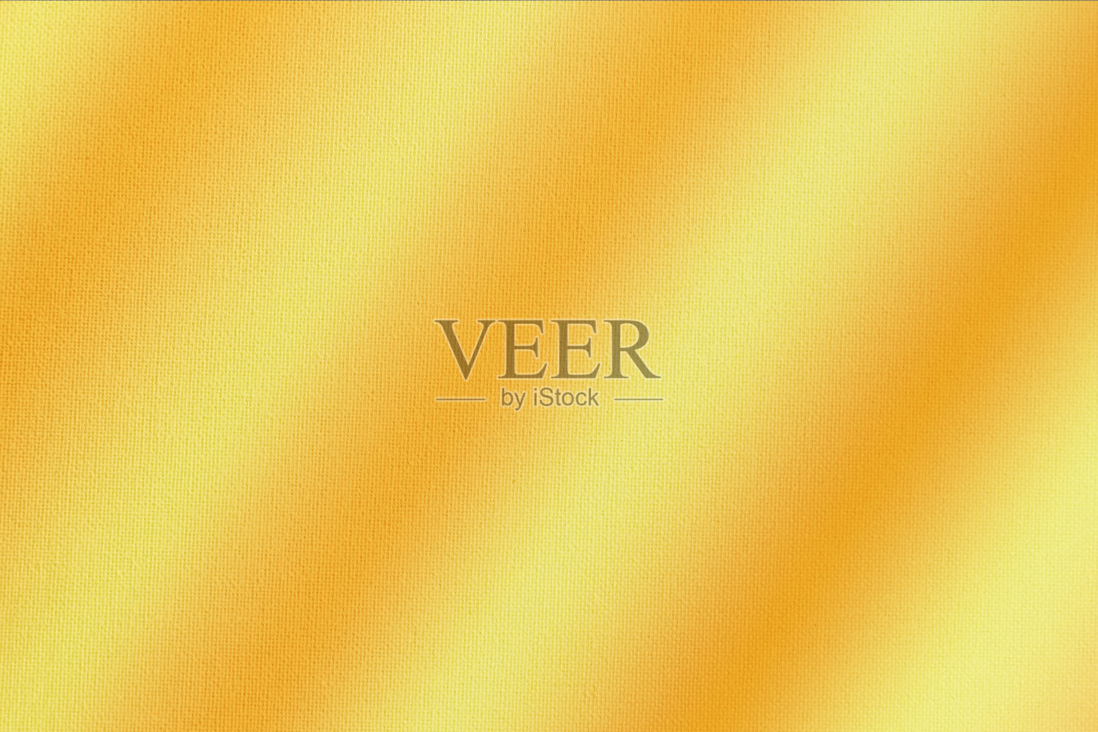 浅棕色、橙色、金色、黄色绸缎。颜色渐变。金色奢华优雅的抽象背景。闪亮的,闪闪发光。窗帘。布料。面料，布料质感。圣诞节,秋天。照片摄影图片