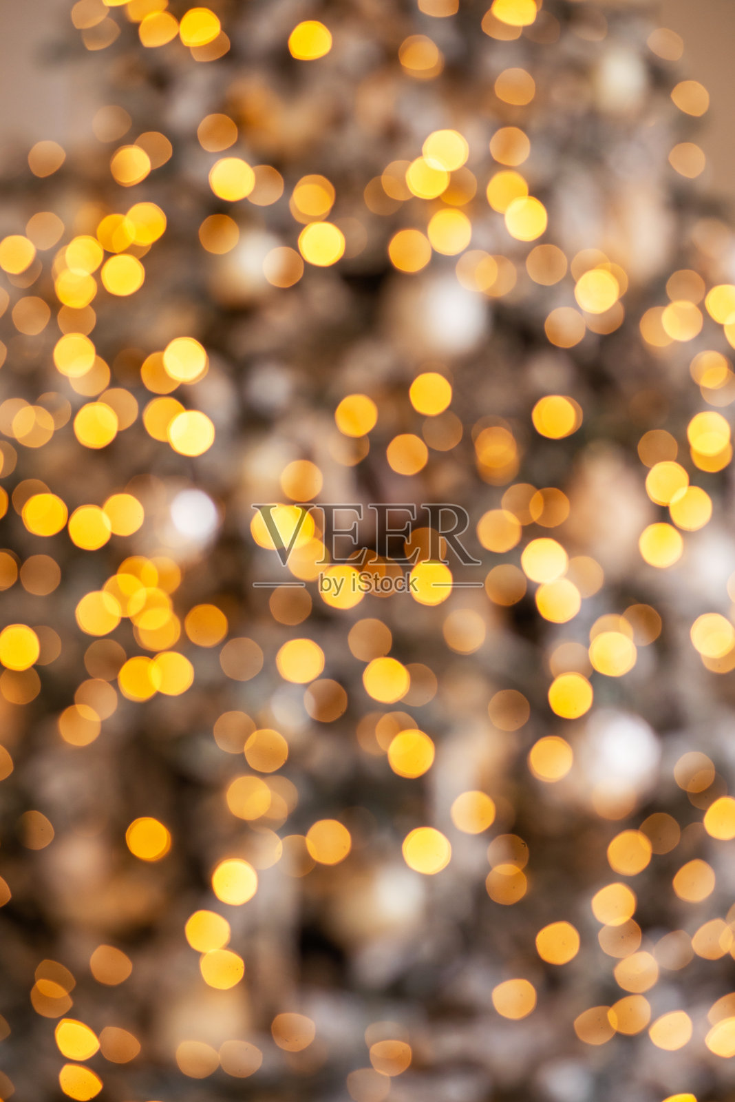 散焦黄金抽象圣诞背景。纹理散景，2024年新年照片摄影图片