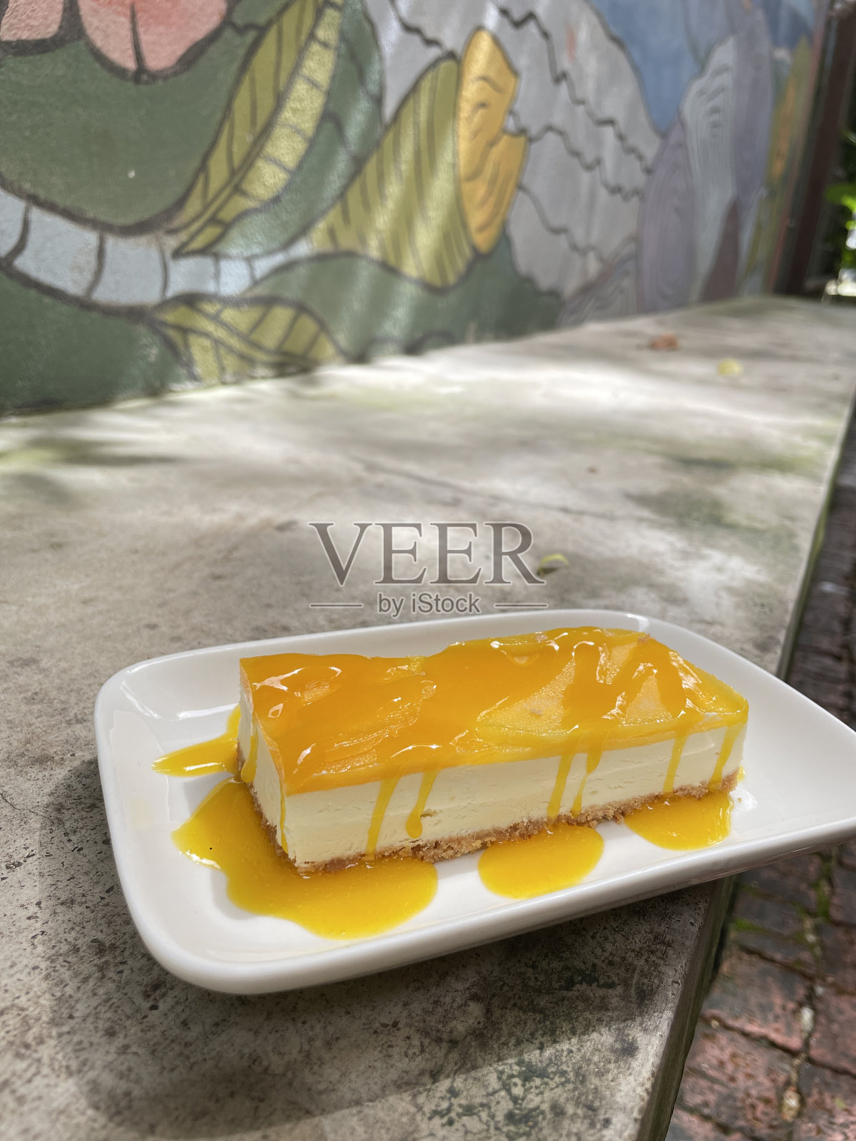 美味的芒果芝士蛋糕照片摄影图片