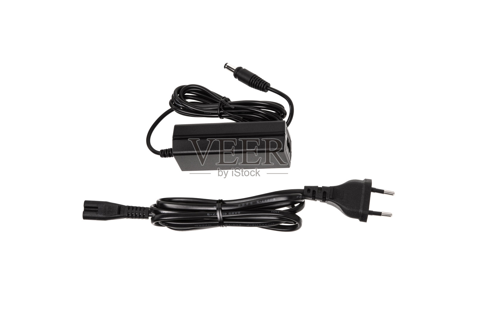 各种电子产品的电源。把220伏交流电转换成直流电的装置。隔离在白色背景上。照片摄影图片