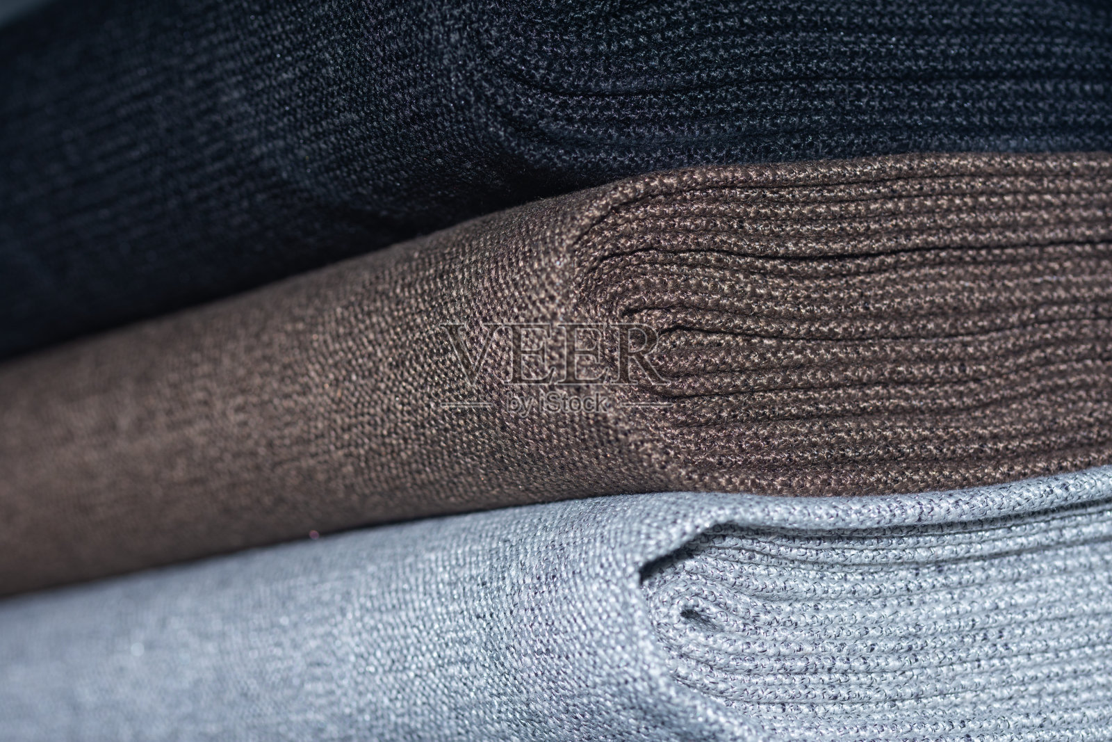 不同颜色的卷装家具用室内装饰织物。照片摄影图片