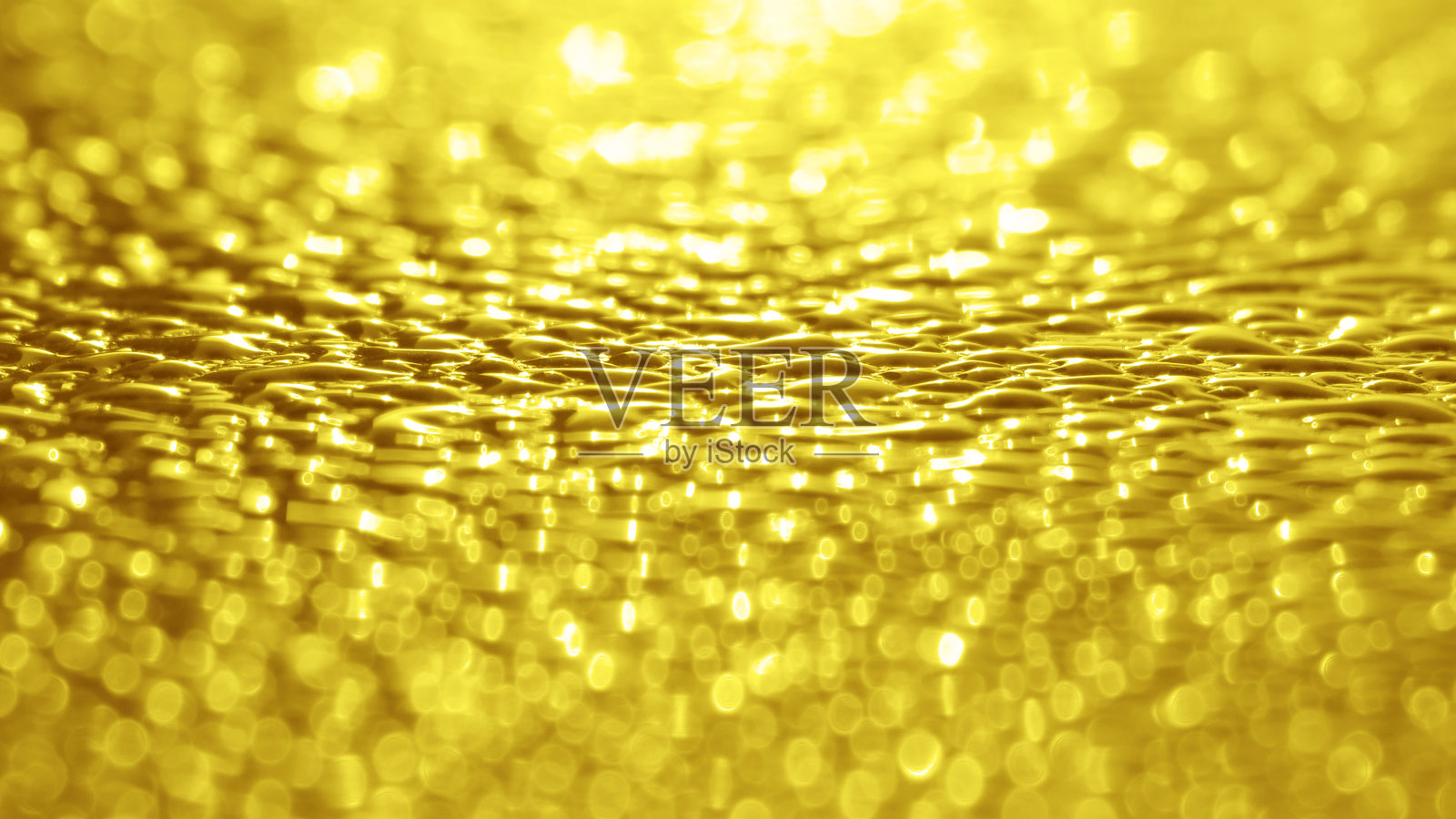 金黄色的光闪烁散景背景。照片摄影图片