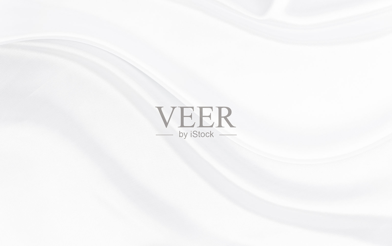 白灰色绸缎质地，即白色银色面料，真丝为底色，具有美丽柔和的自然模糊花纹。照片摄影图片