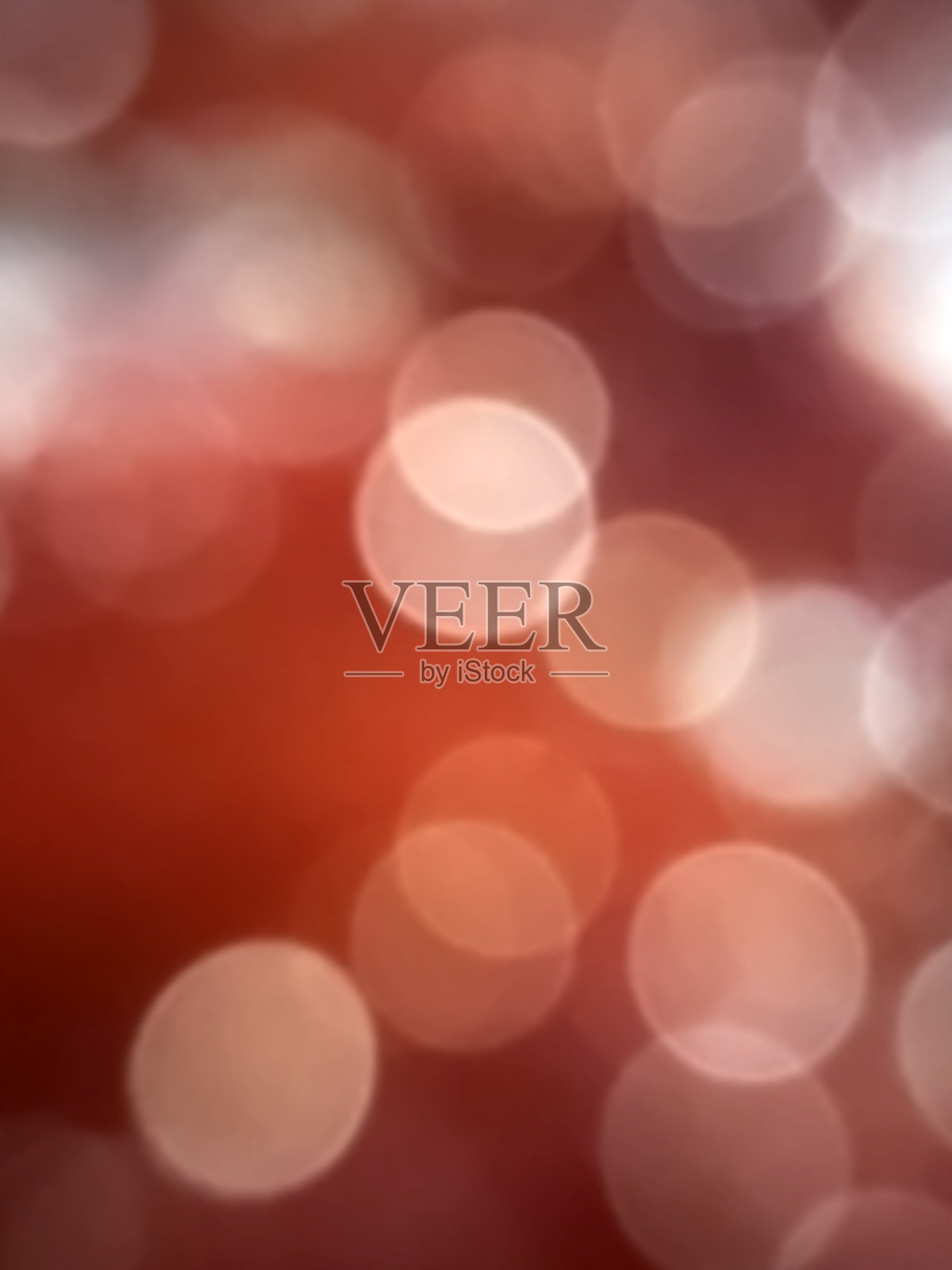 气泡光散景将所有的帧散焦光与暗红色抽象背景展开。照片摄影图片