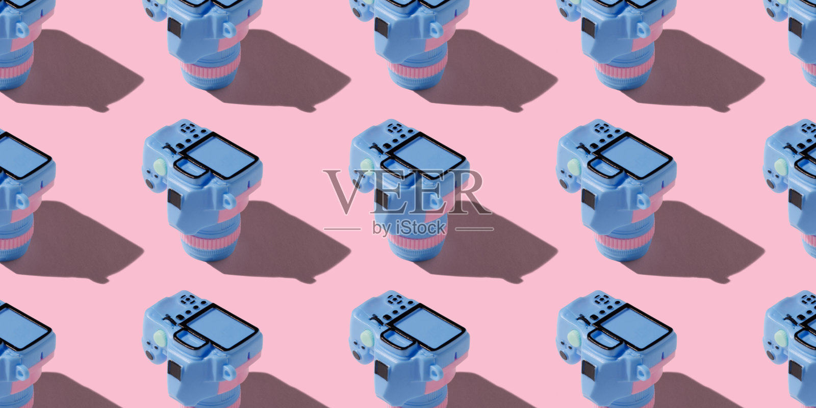 图案与单反相机在柔和的颜色背景照片摄影图片