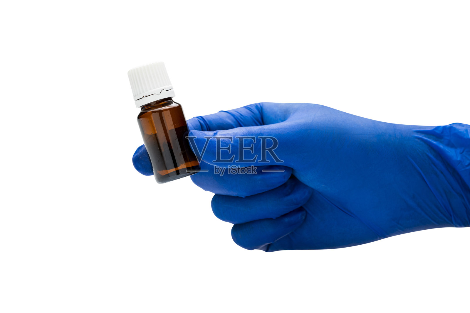 用医用手套拿药瓶的手照片摄影图片