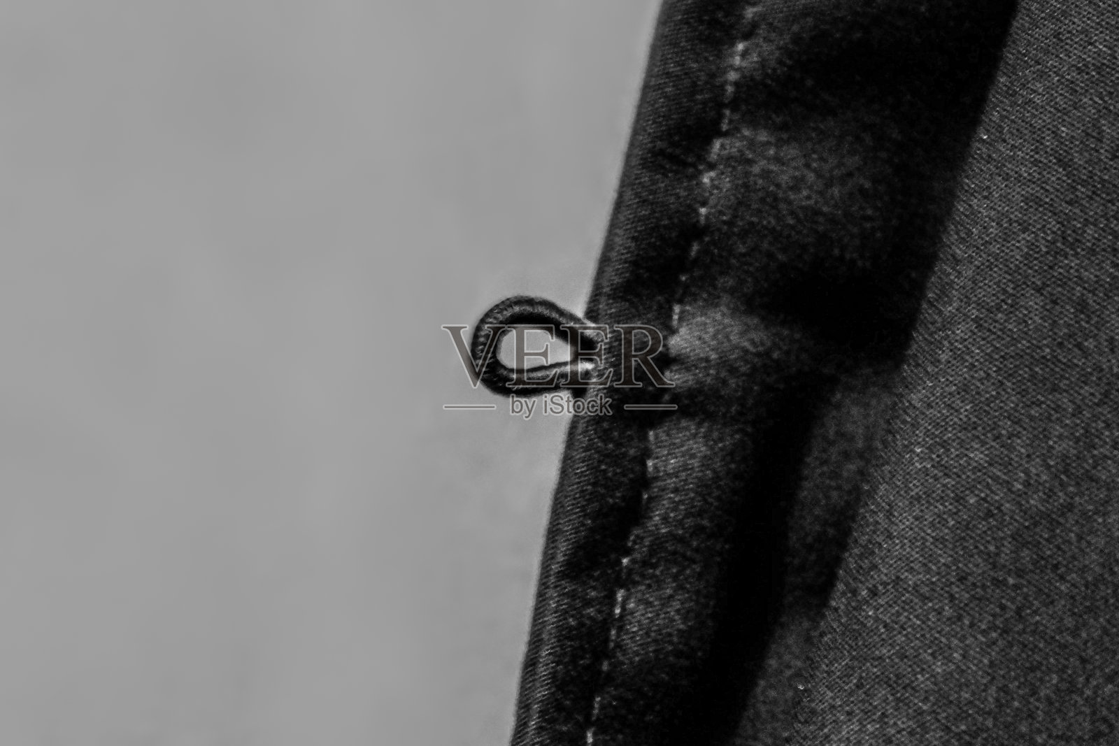 衣服上钮扣的洞照片摄影图片