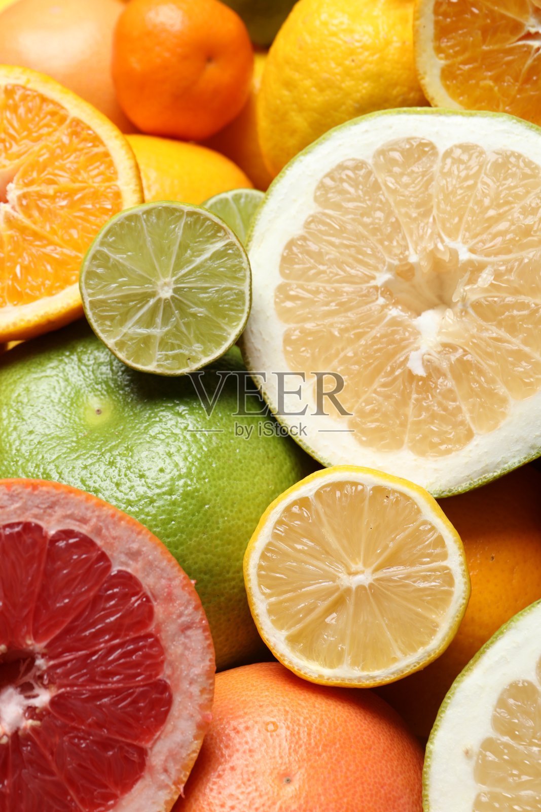 不同的成熟柑橘类水果作为背景，特写照片摄影图片