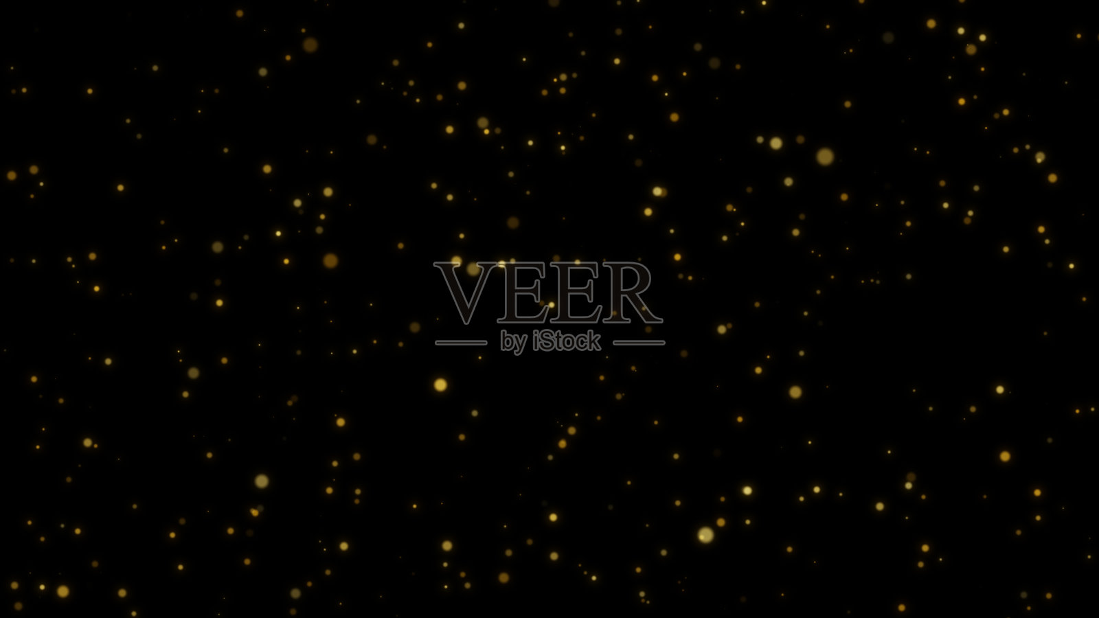 金色的微粒在黑色的背景上闪烁照片摄影图片