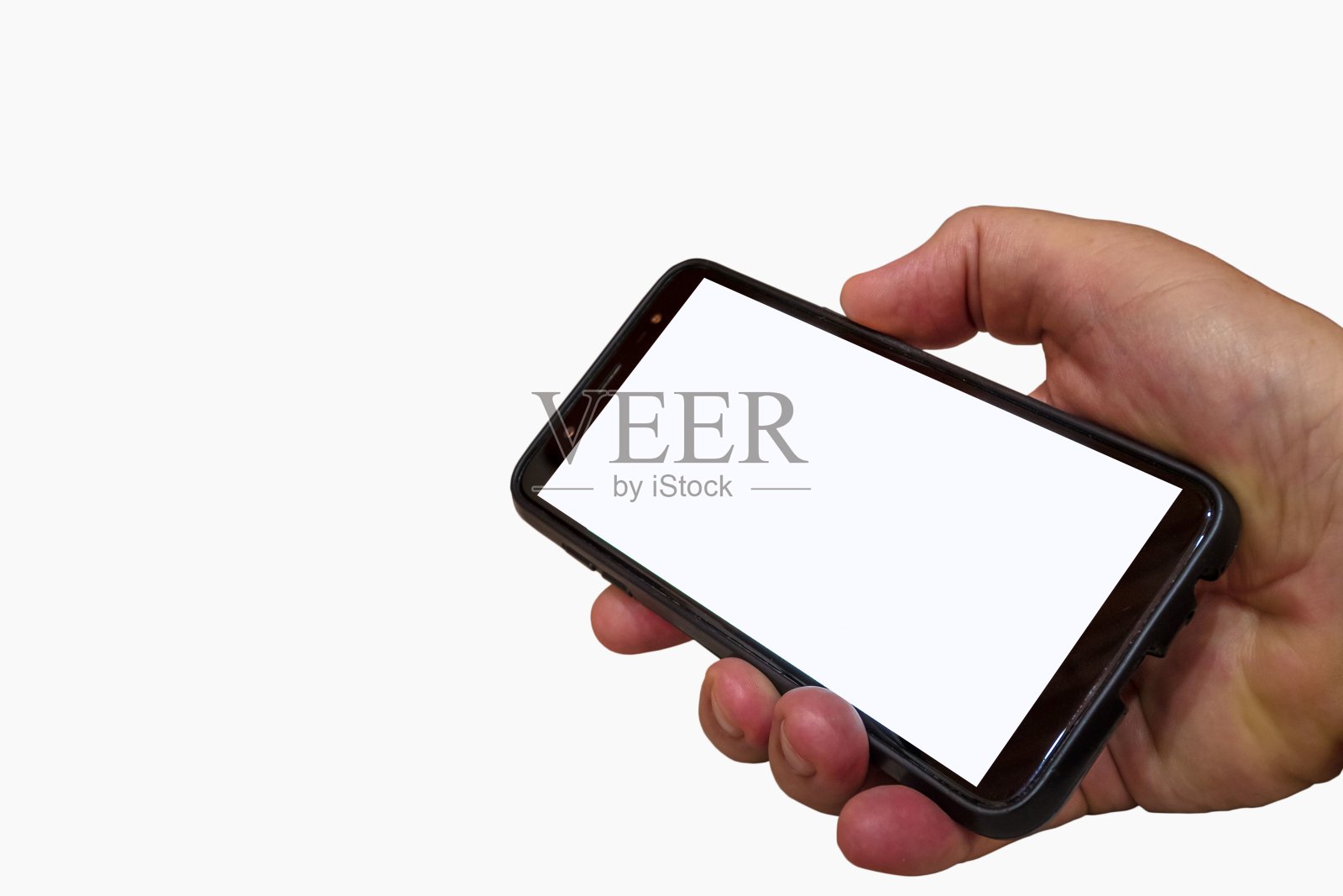 一名男子手持白屏智能手机的特写。照片摄影图片