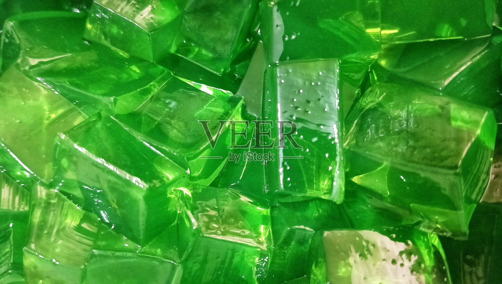 绿色果冻纹理的背景。照片摄影图片