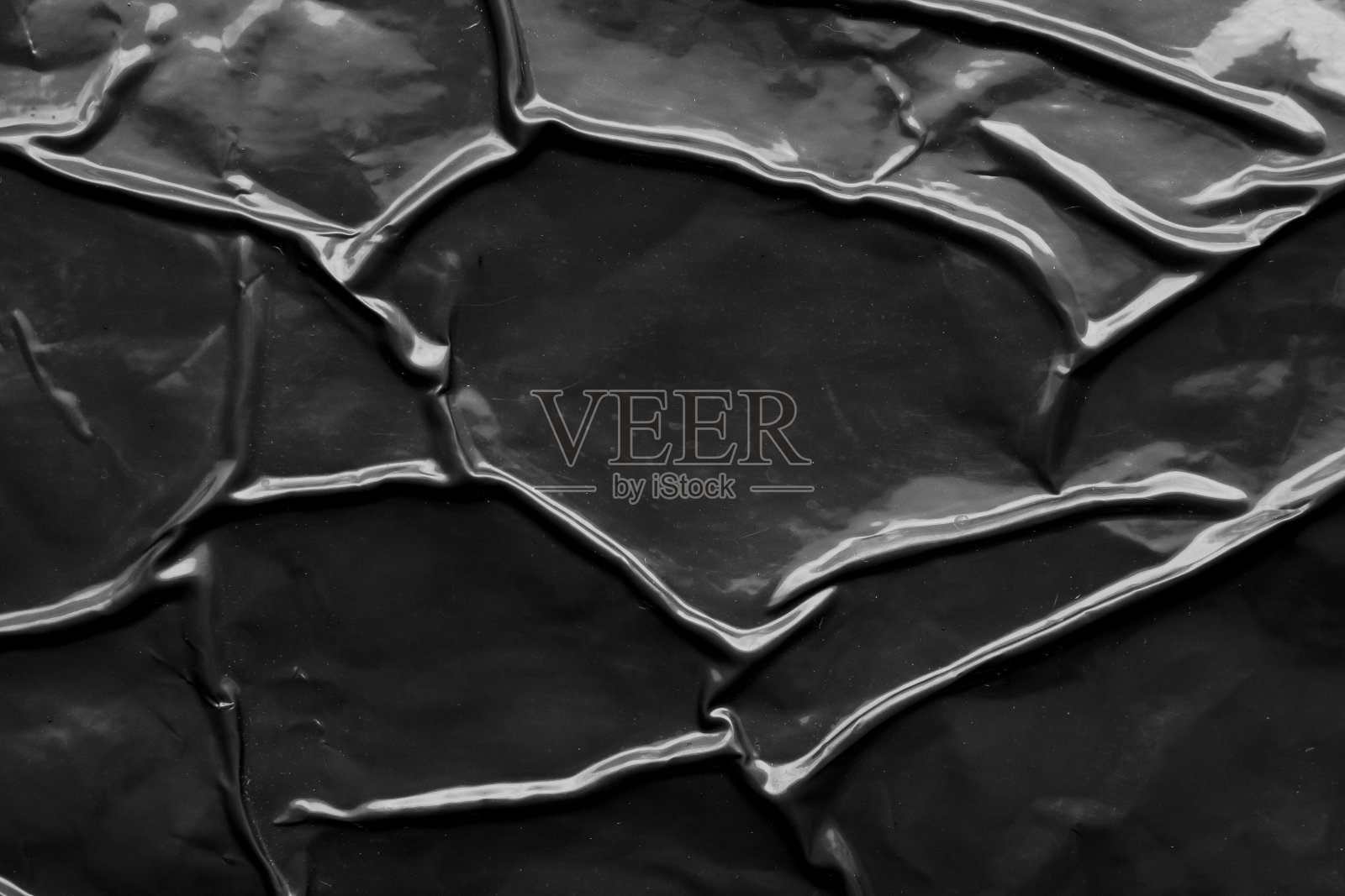 黑色褶皱和折痕塑料海报纹理背景照片摄影图片