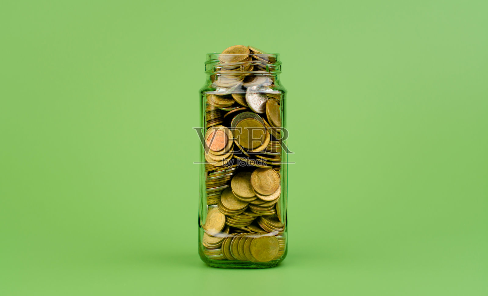 在玻璃罐里存钱金融，银行，投资，财务增长财务收入，现金流，收入和支出照片摄影图片