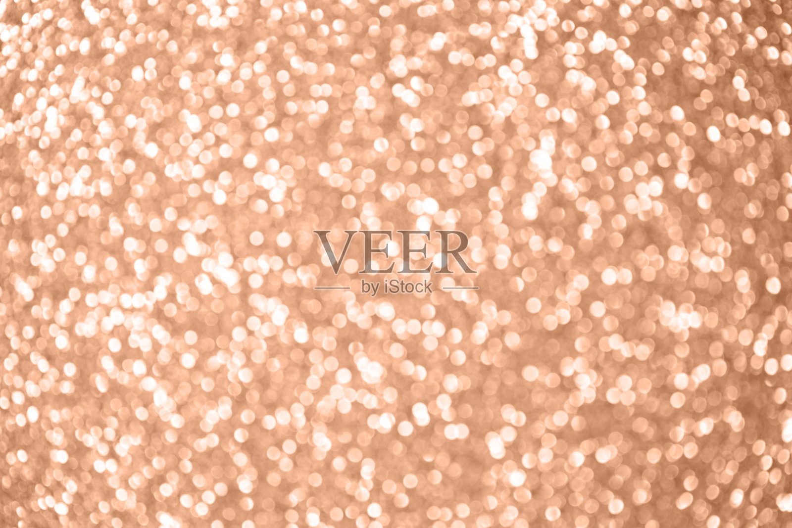 单色桃子模糊闪闪发光的散景背景。2024年流行色桃毛。照片摄影图片