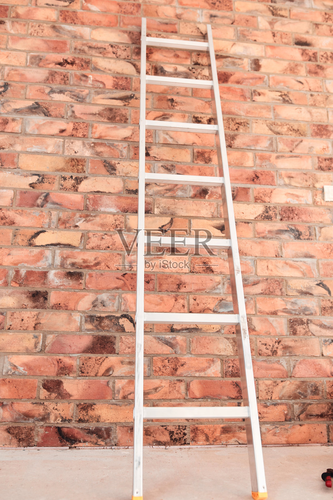 建筑工地上的梯子。照片摄影图片