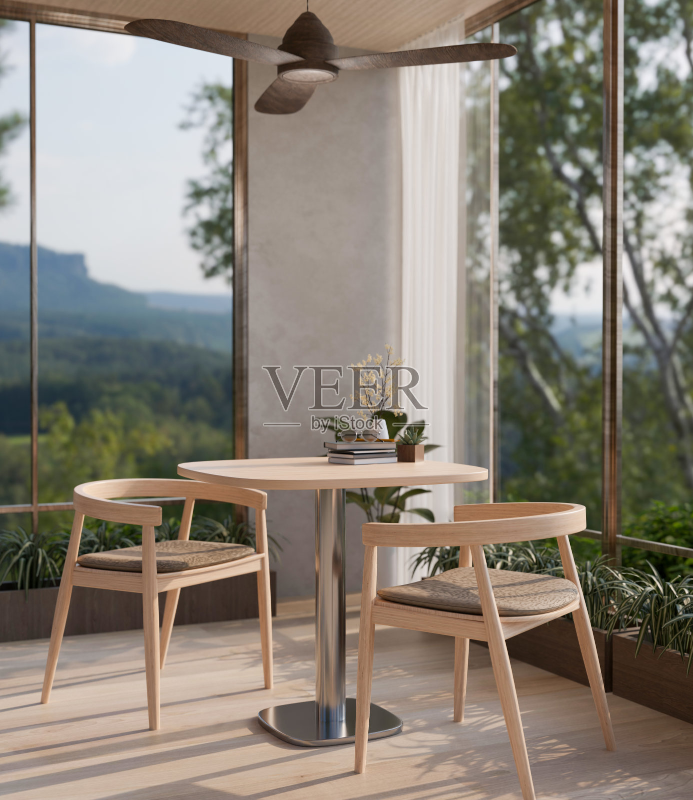 这是一间现代斯堪的纳维亚风格的客房，靠近玻璃窗的地方有一张木制餐桌，可以看到自然景观。照片摄影图片