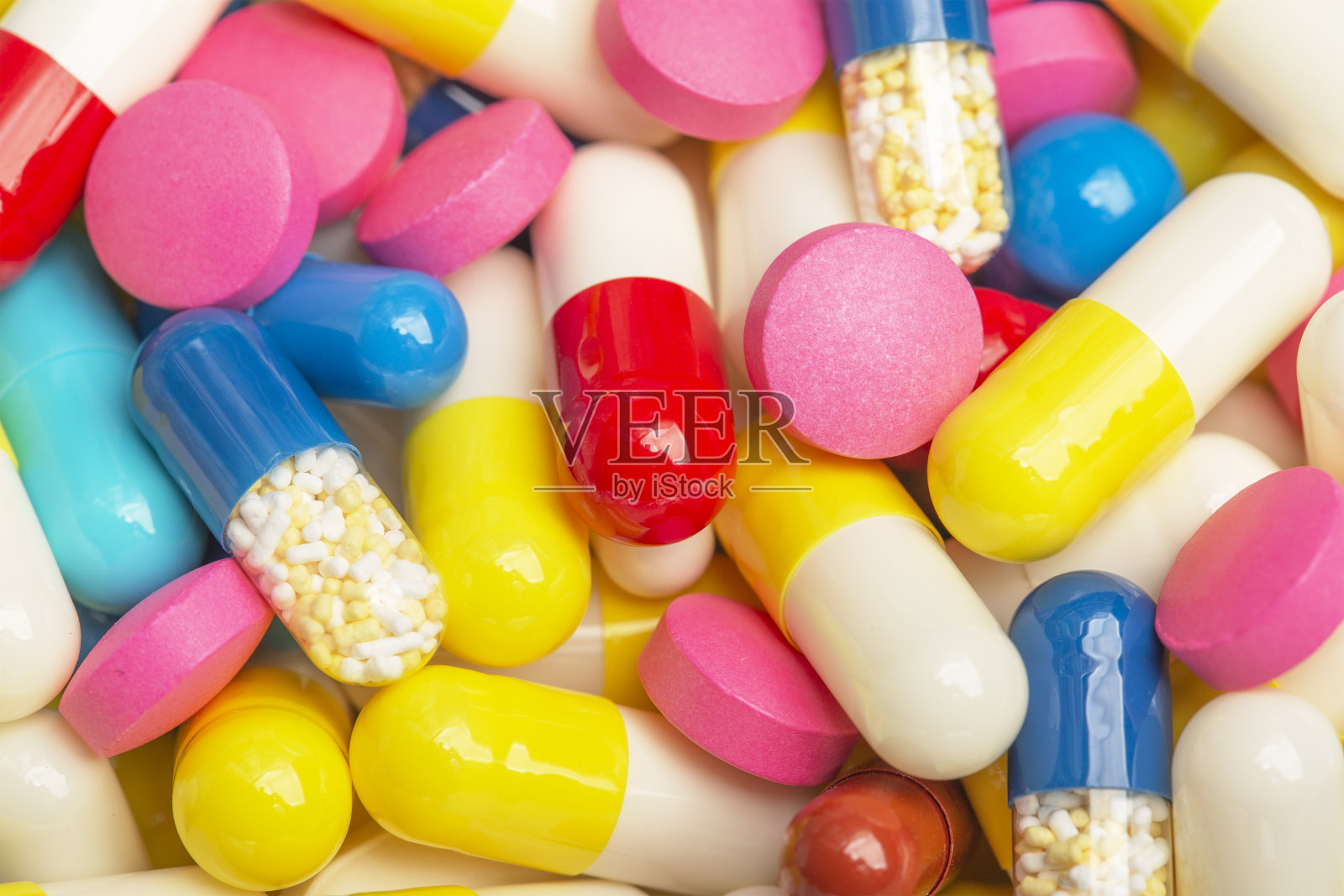 不同颜色的药片背景照片摄影图片