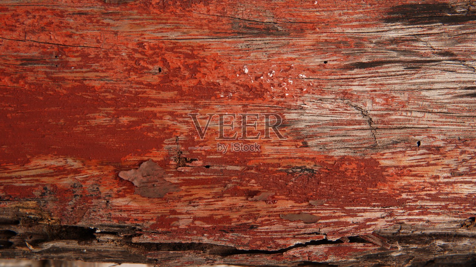 油漆旧木制背景。旧木材纹理背景与红色油漆。粉刷旧木墙。红色的背景。风化木纹背景照片摄影图片