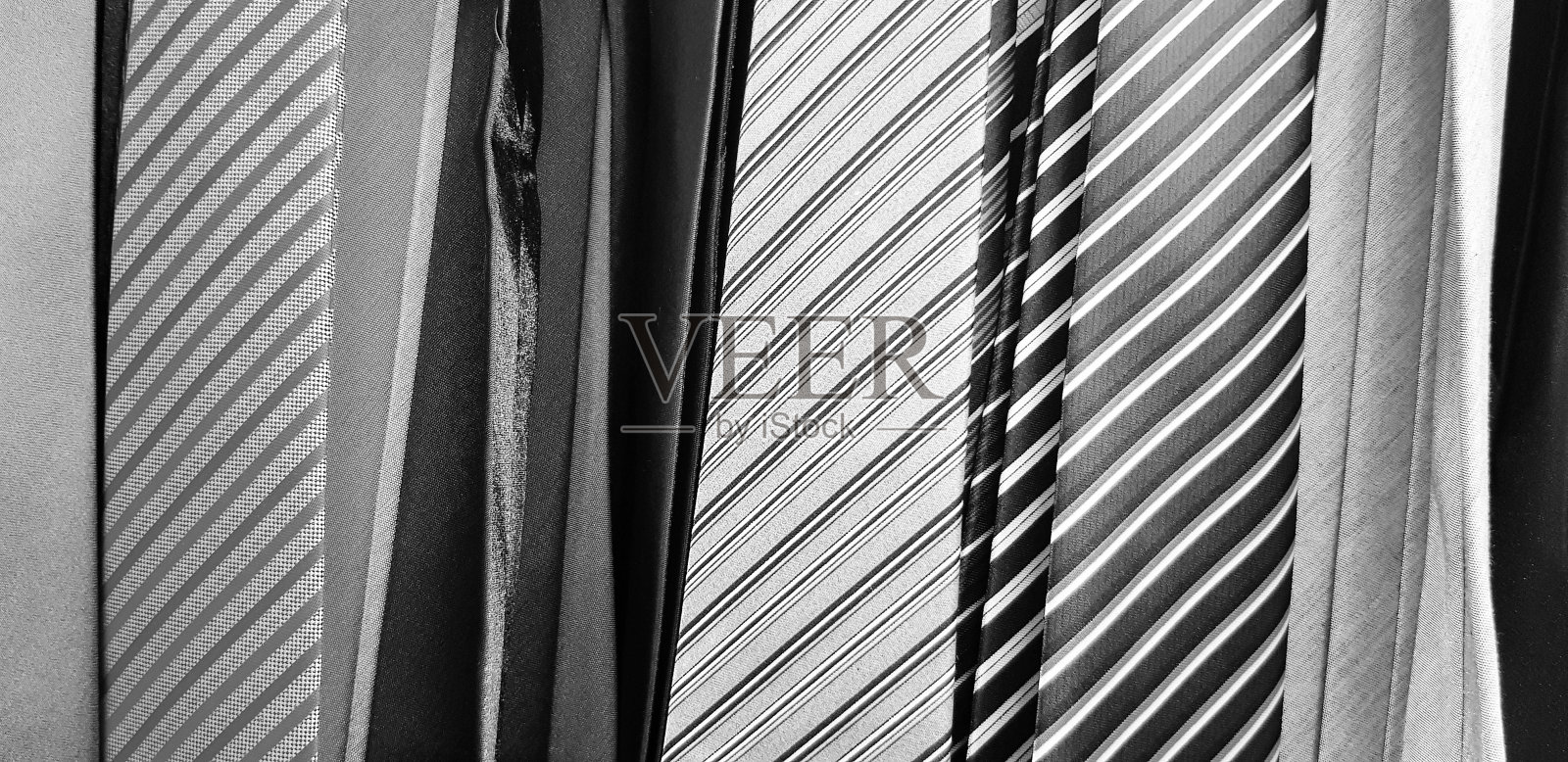 许多黑白色调领带的图案和线条。近距离织物和艺术背景在单色风格的概念。照片摄影图片