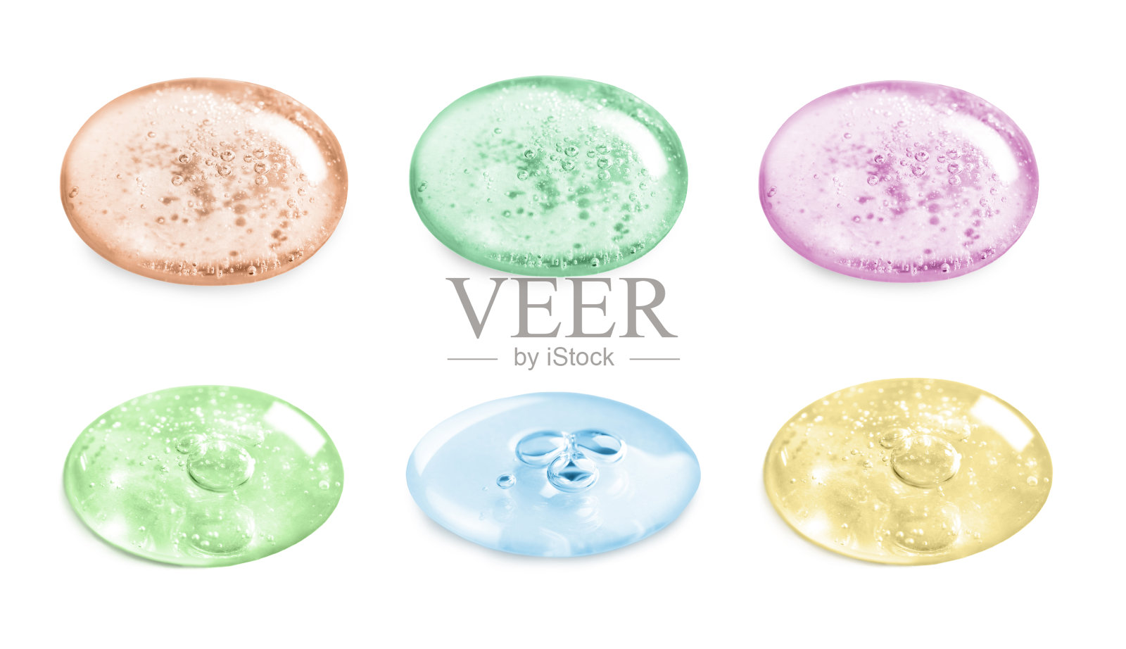 血清滴在白色背景上，设定。护肤品照片摄影图片