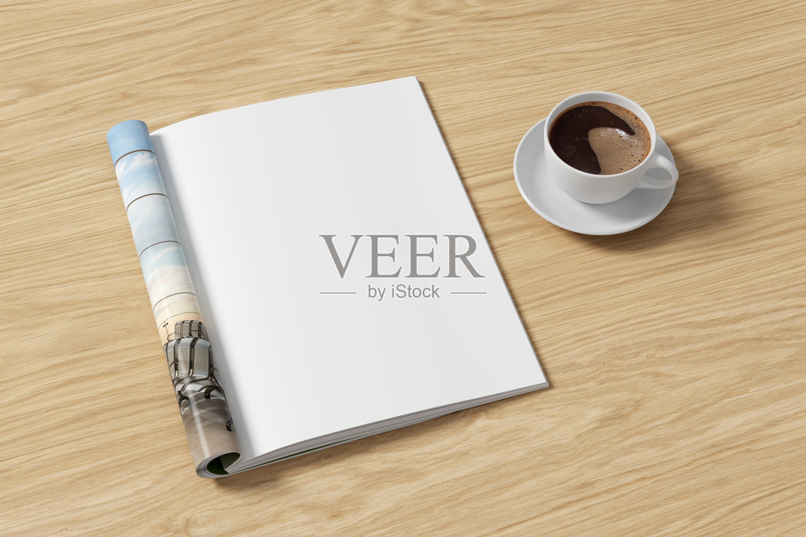 杂志右页的模型和木桌上的一杯咖啡照片摄影图片