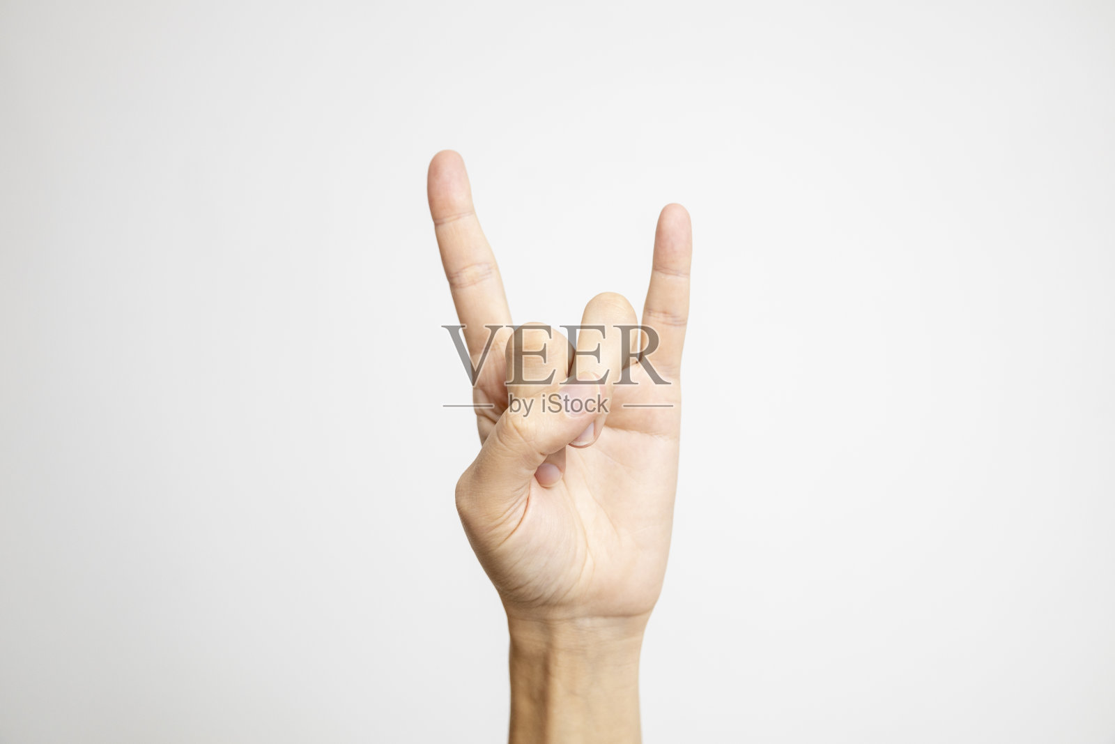 摇滚和滚动手符号显示在一个白色的背景。照片摄影图片