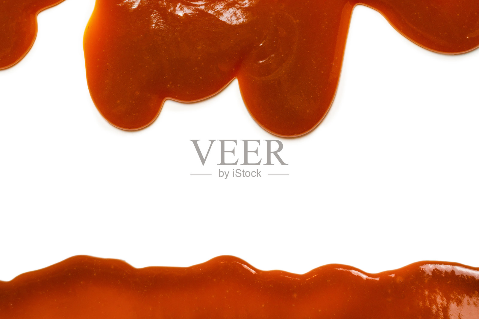 背景流动的焦糖酱隔离在白色。照片摄影图片