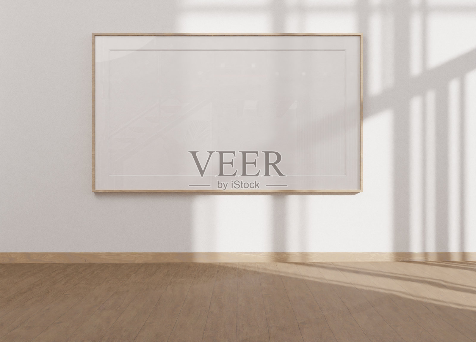 白墙上的空白框架照片摄影图片