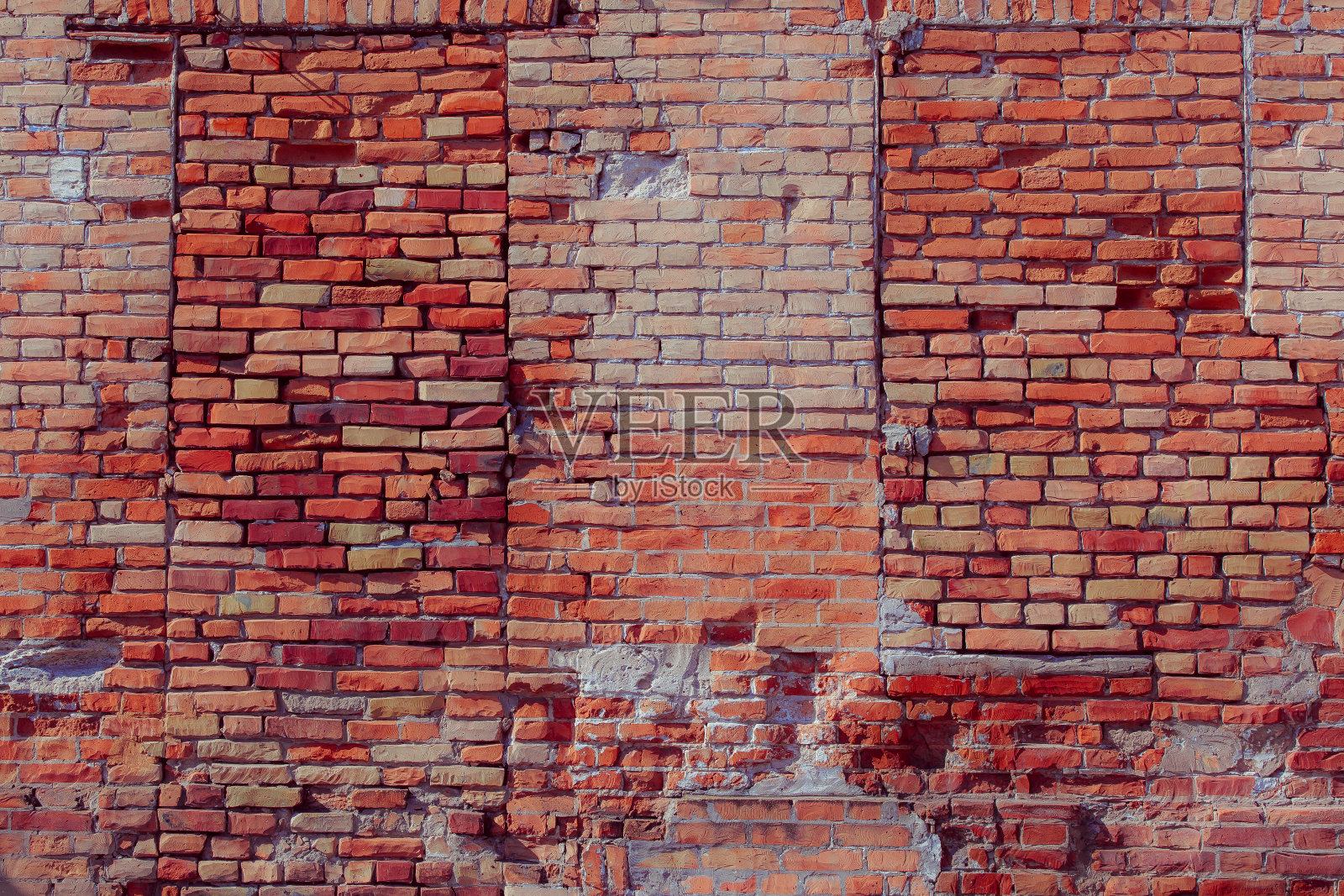 破旧的红砖墙。照片摄影图片