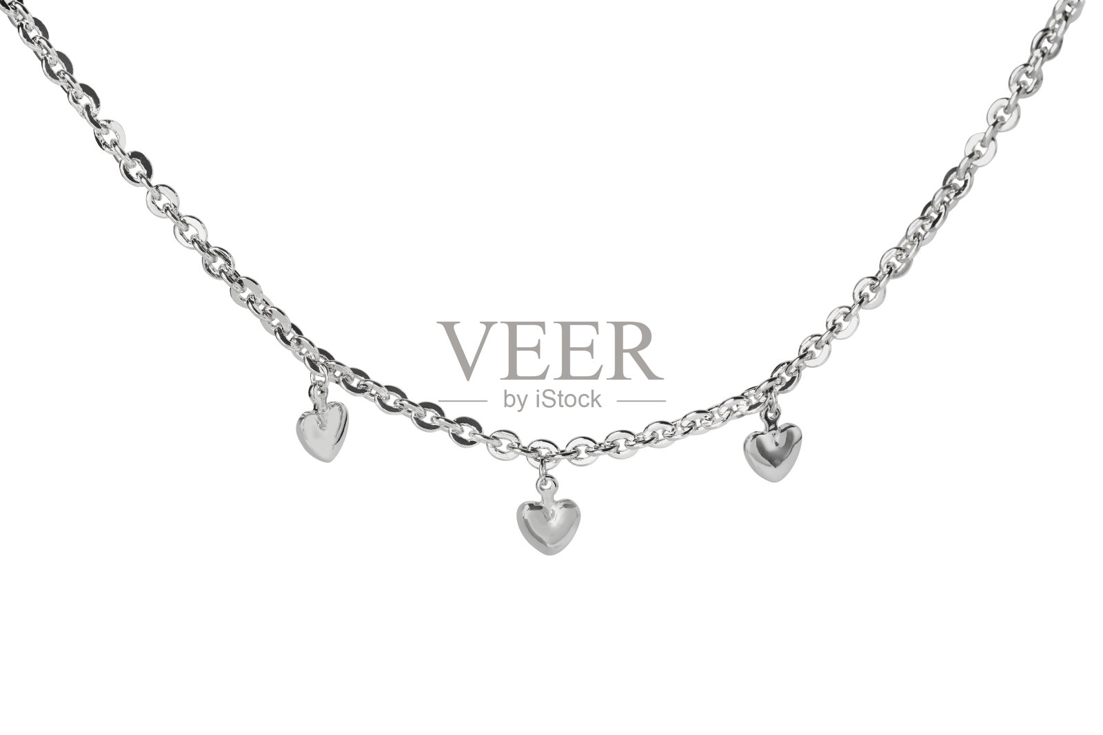一个金属链与心吊坠隔离在白色。奢华的珠宝照片摄影图片