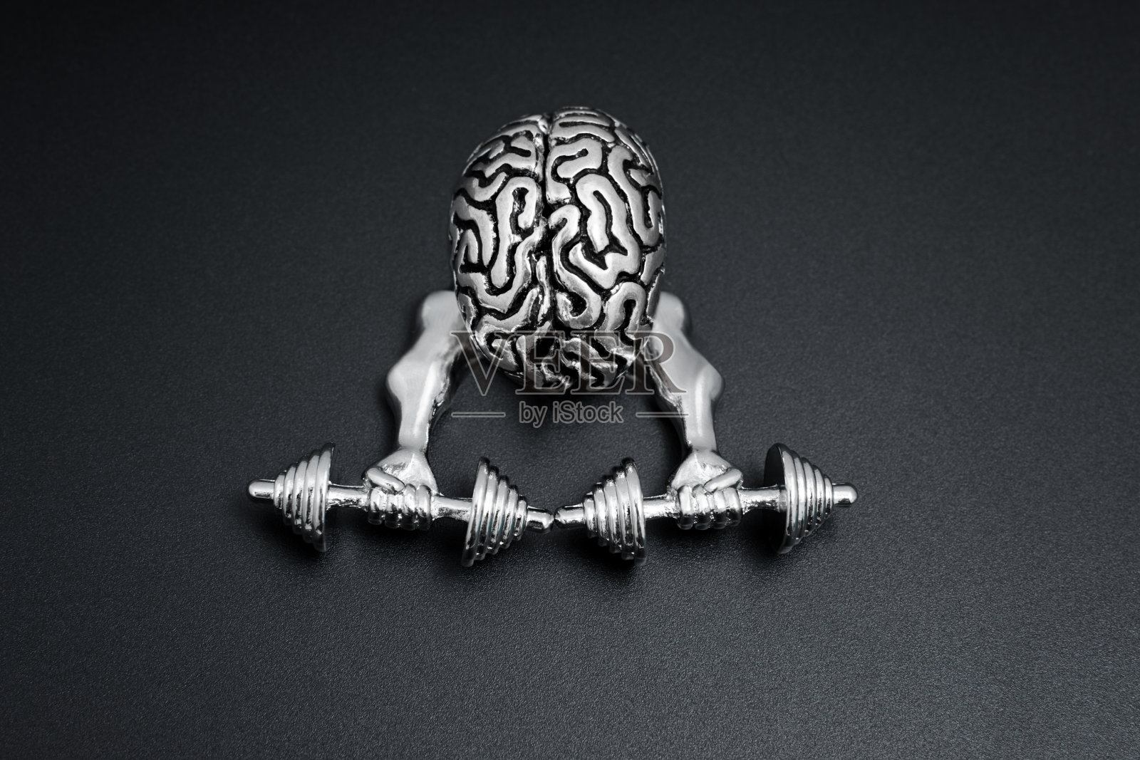 用肌肉发达的手锻炼大脑照片摄影图片