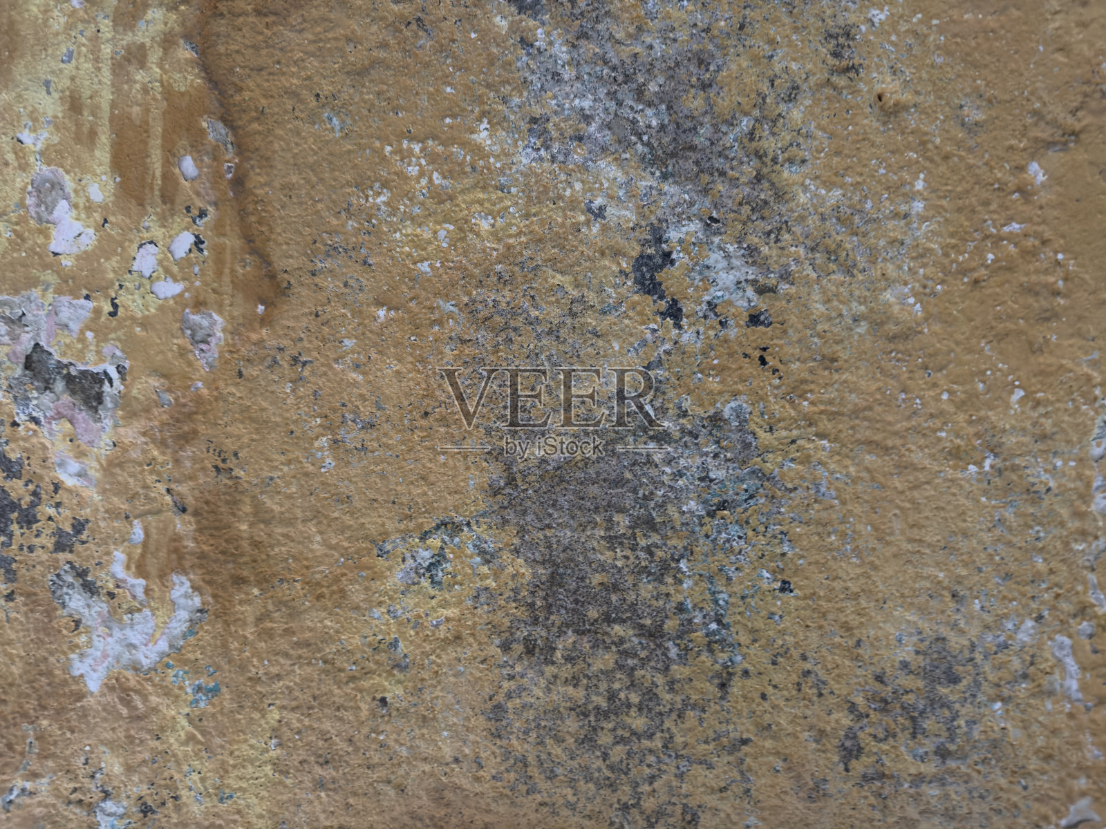 抽象的，细节的，图案的一段多色剥落的油漆层在一个古老的石头外墙。没有人。火鸡。照片摄影图片