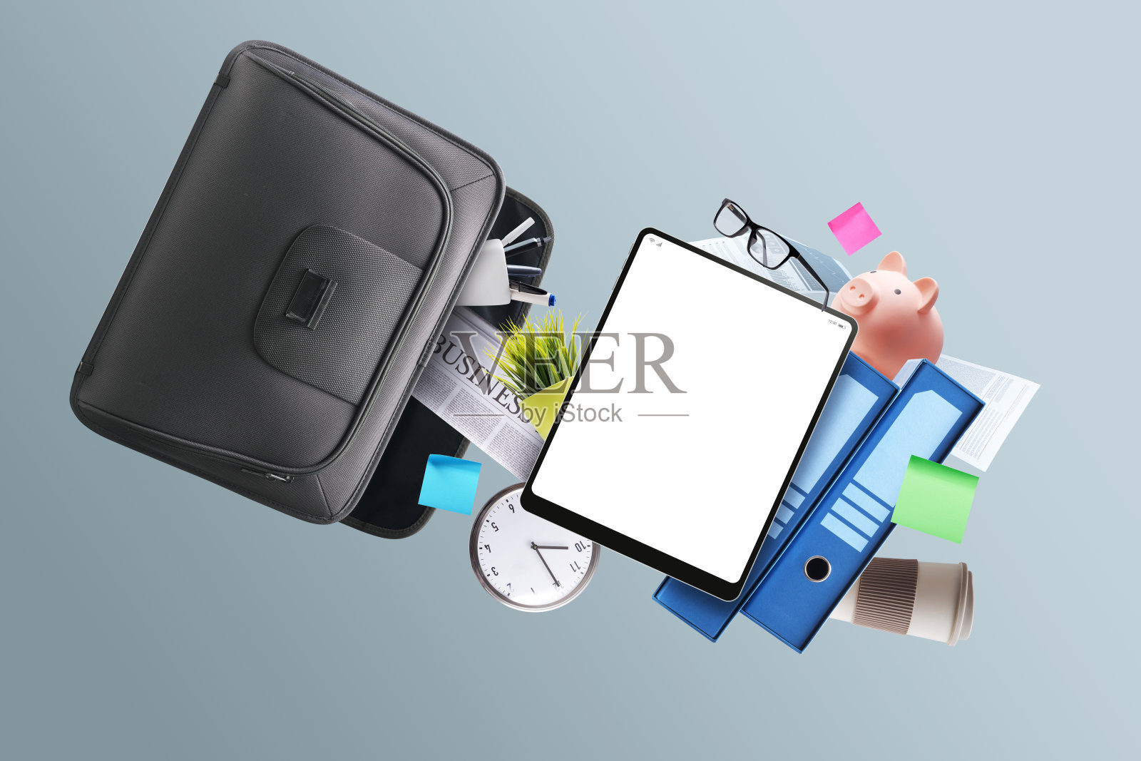 公文包和办公用品掉了出来照片摄影图片