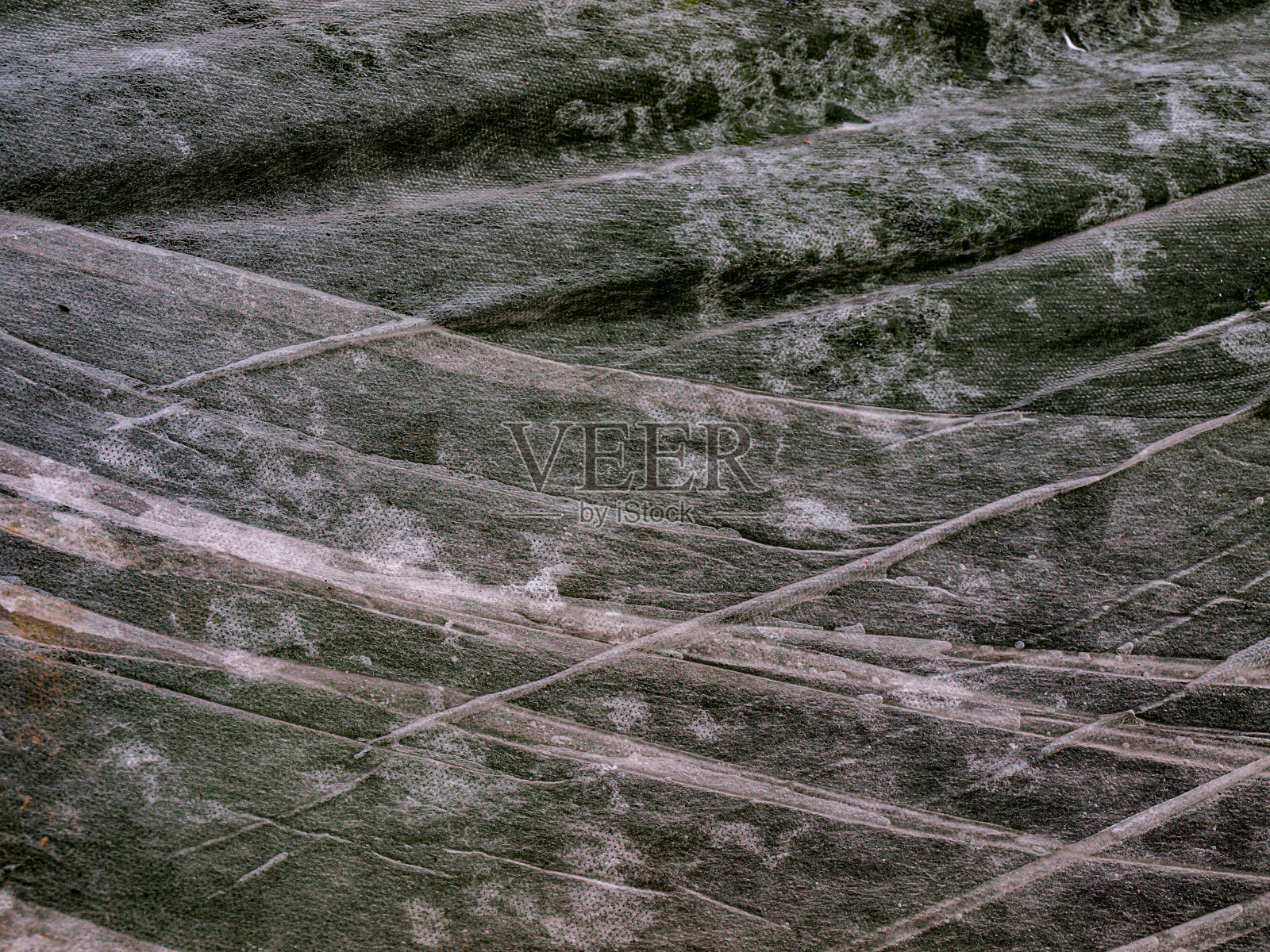 湿覆盖物的质地。美丽如画的织物纹理。照片摄影图片