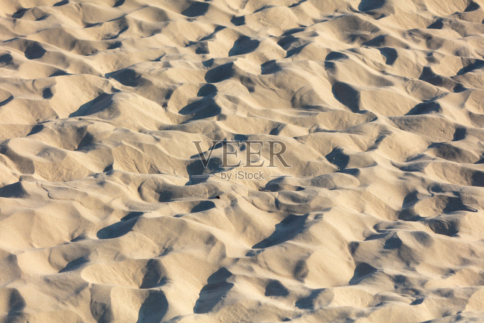 白色的沙子在大自然中作为抽象的背景。纹理照片摄影图片