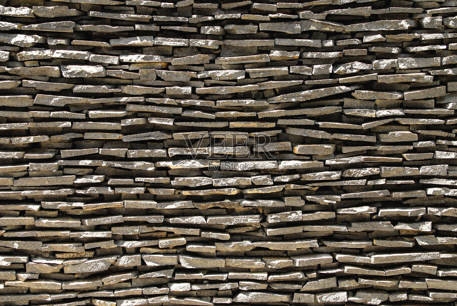 石板或石板堆成灰色背景墙照片摄影图片