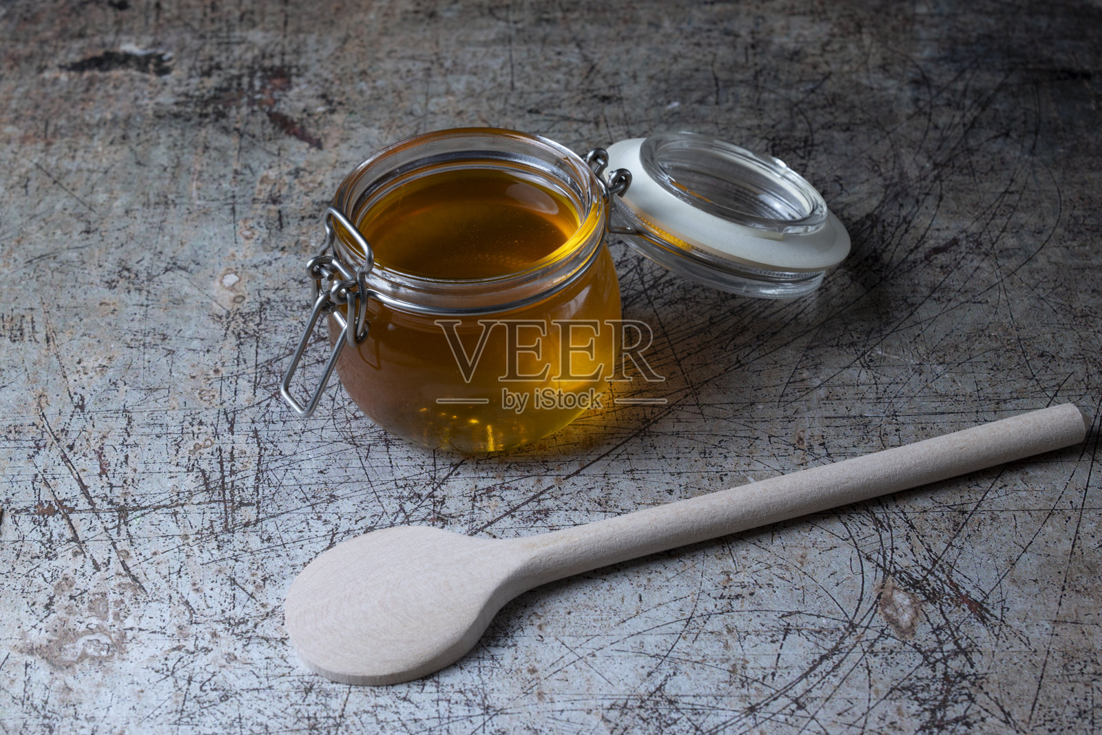 用木勺装蜂蜜照片摄影图片