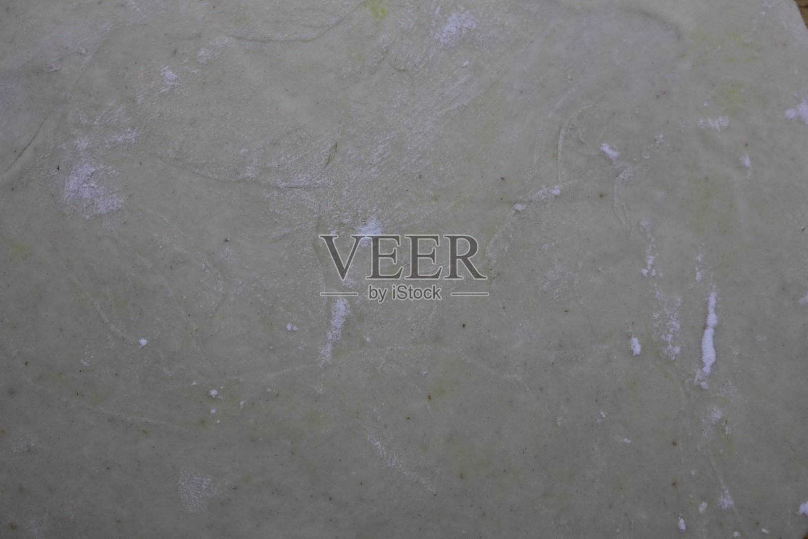 面团的结构与少许白面粉微距拍摄照片摄影图片