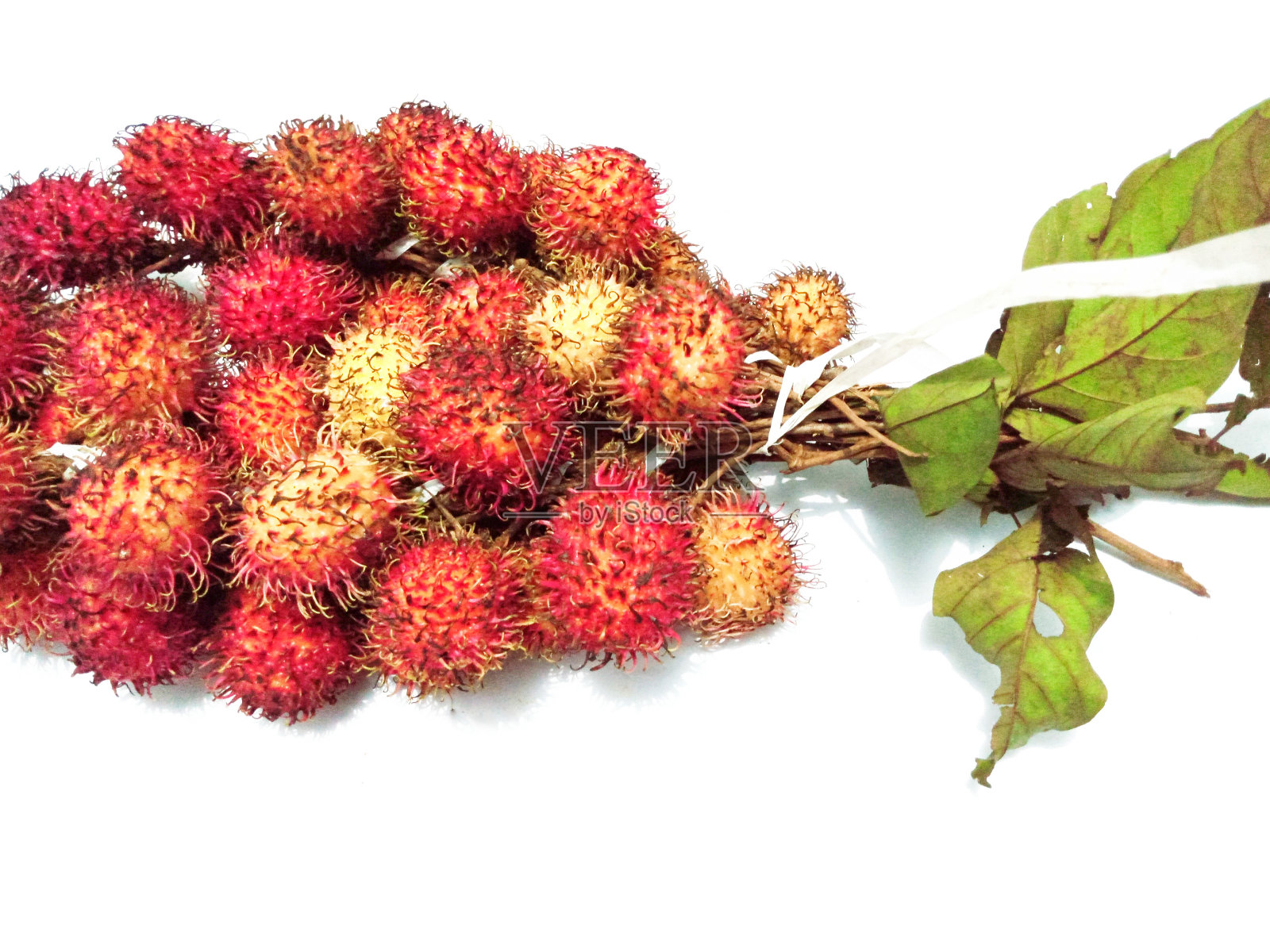 白色背景上的红毛丹果实照片摄影图片