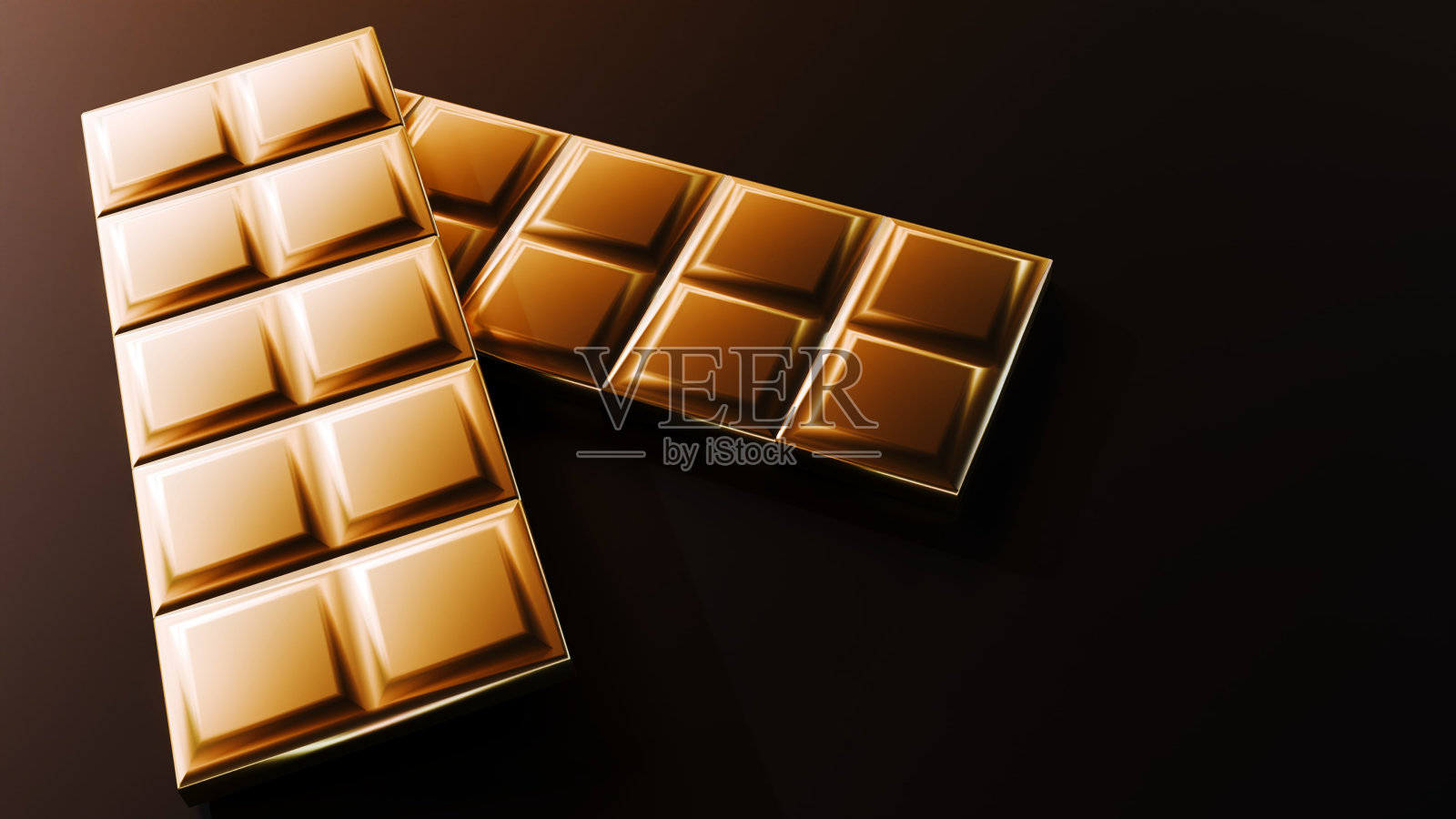 棕色背景上的金色巧克力棒照片摄影图片