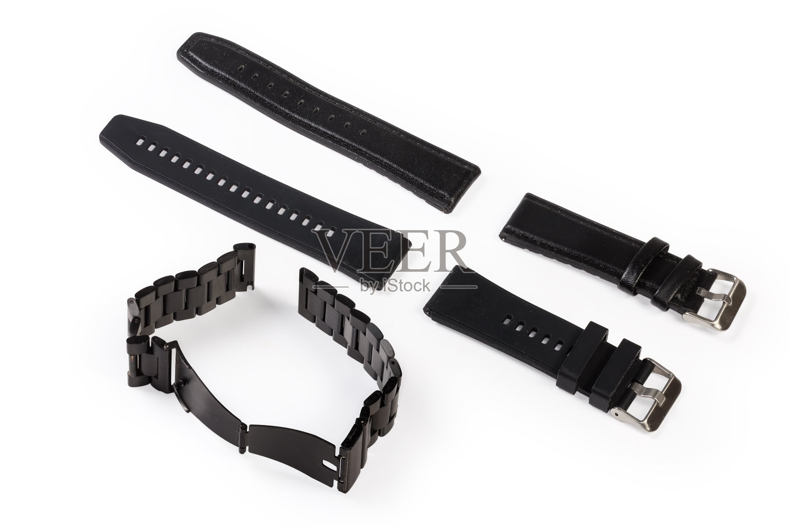 黑色表带的腕表与不同的材料照片摄影图片