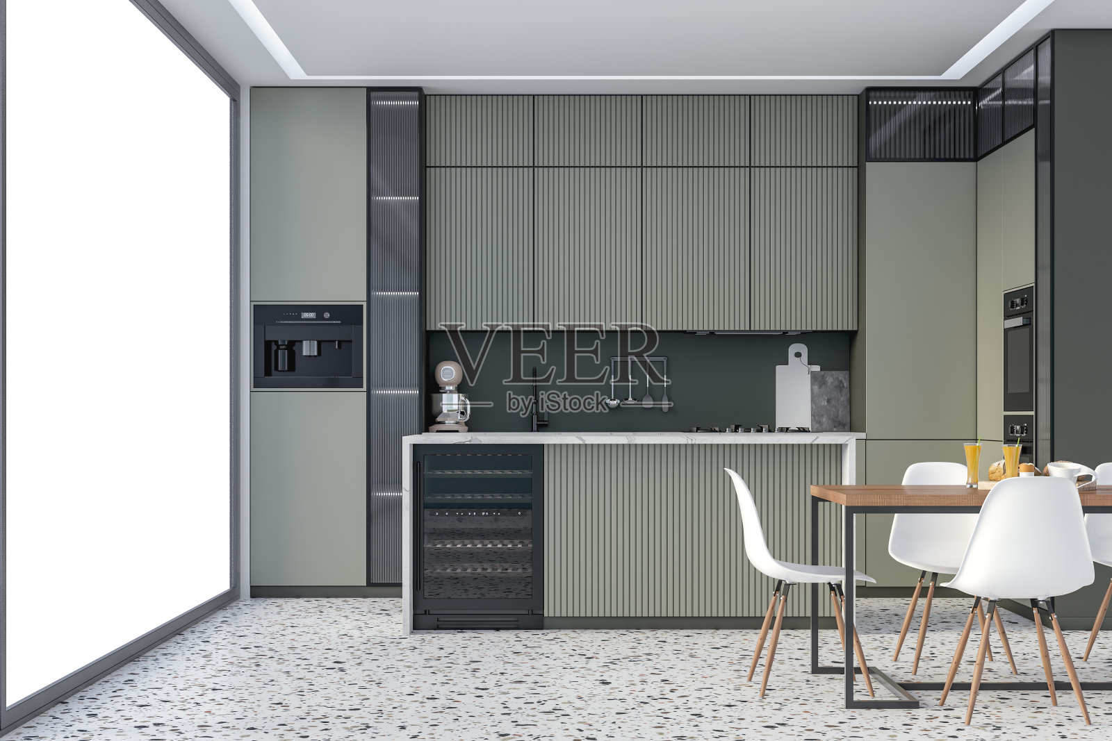 现代卡其绿色厨房，大理石长方形早餐厨房岛台，全餐桌，水磨石地板上的白色椅子，一侧有一扇大落地窗照片摄影图片