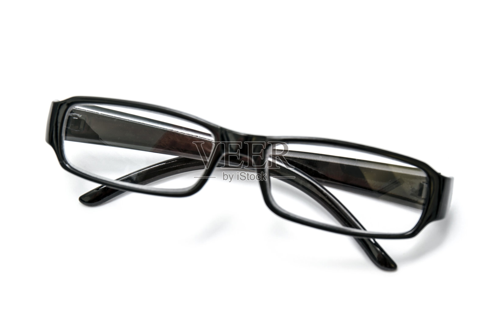 黑色的眼镜被白色隔开照片摄影图片