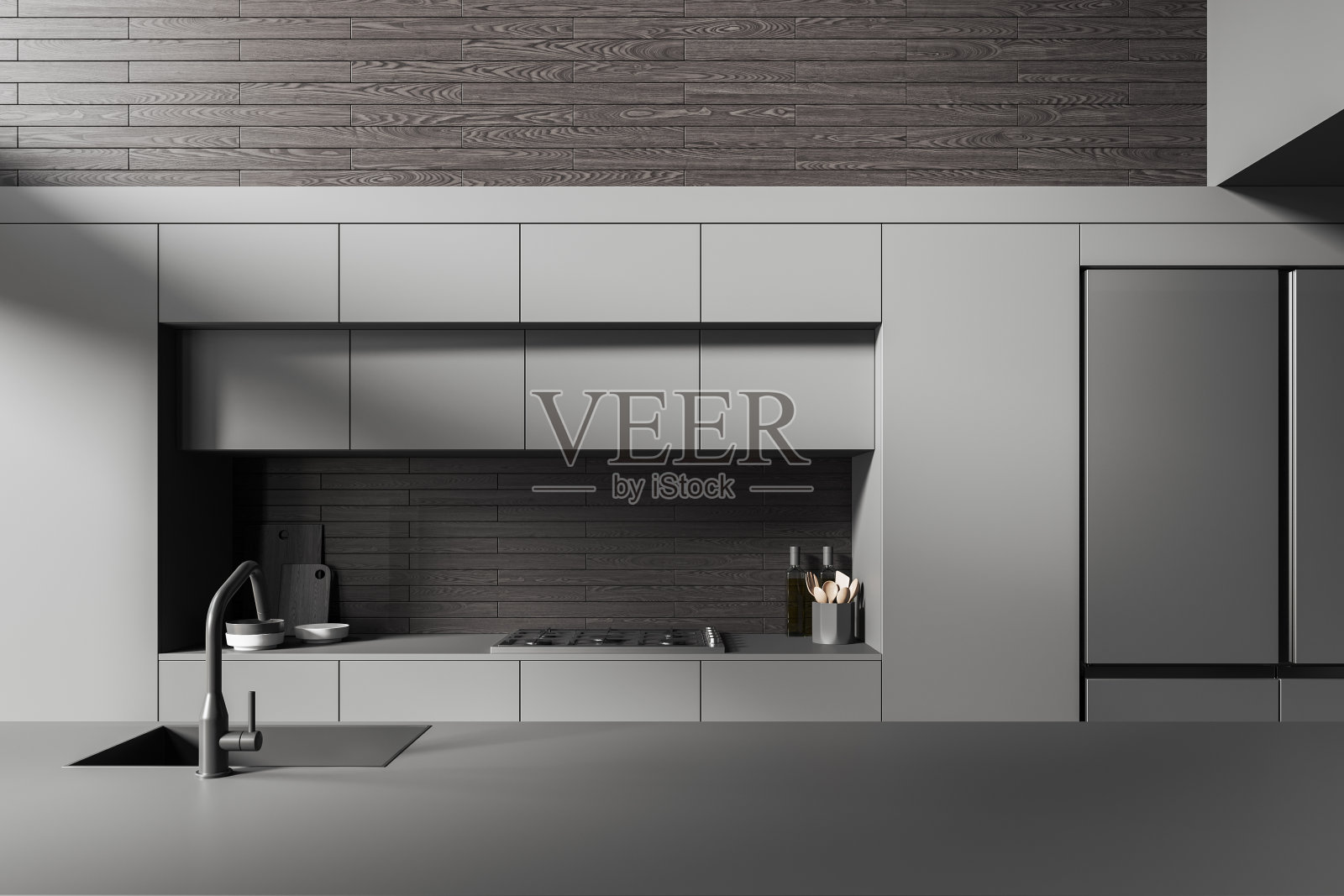 灰色家庭厨房内饰，配有柜台，水槽和带冰箱的厨具照片摄影图片