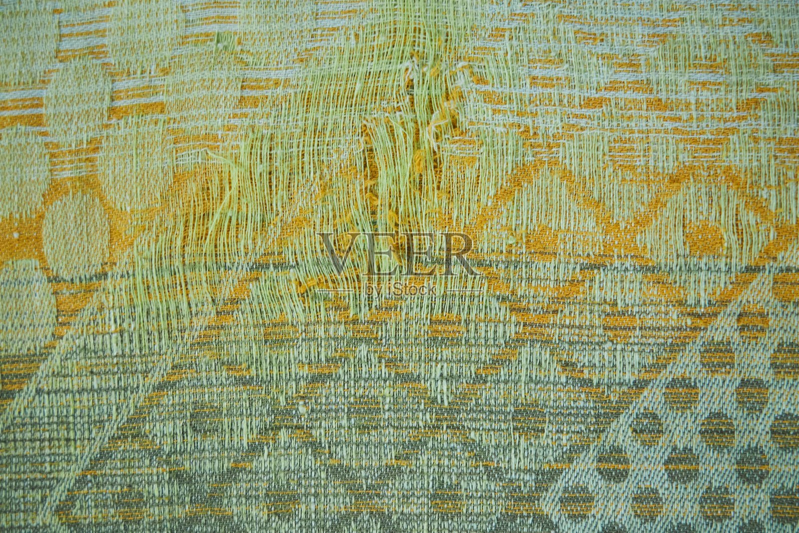 旧挂毯织物的质地是绿色的，带有花纹照片摄影图片