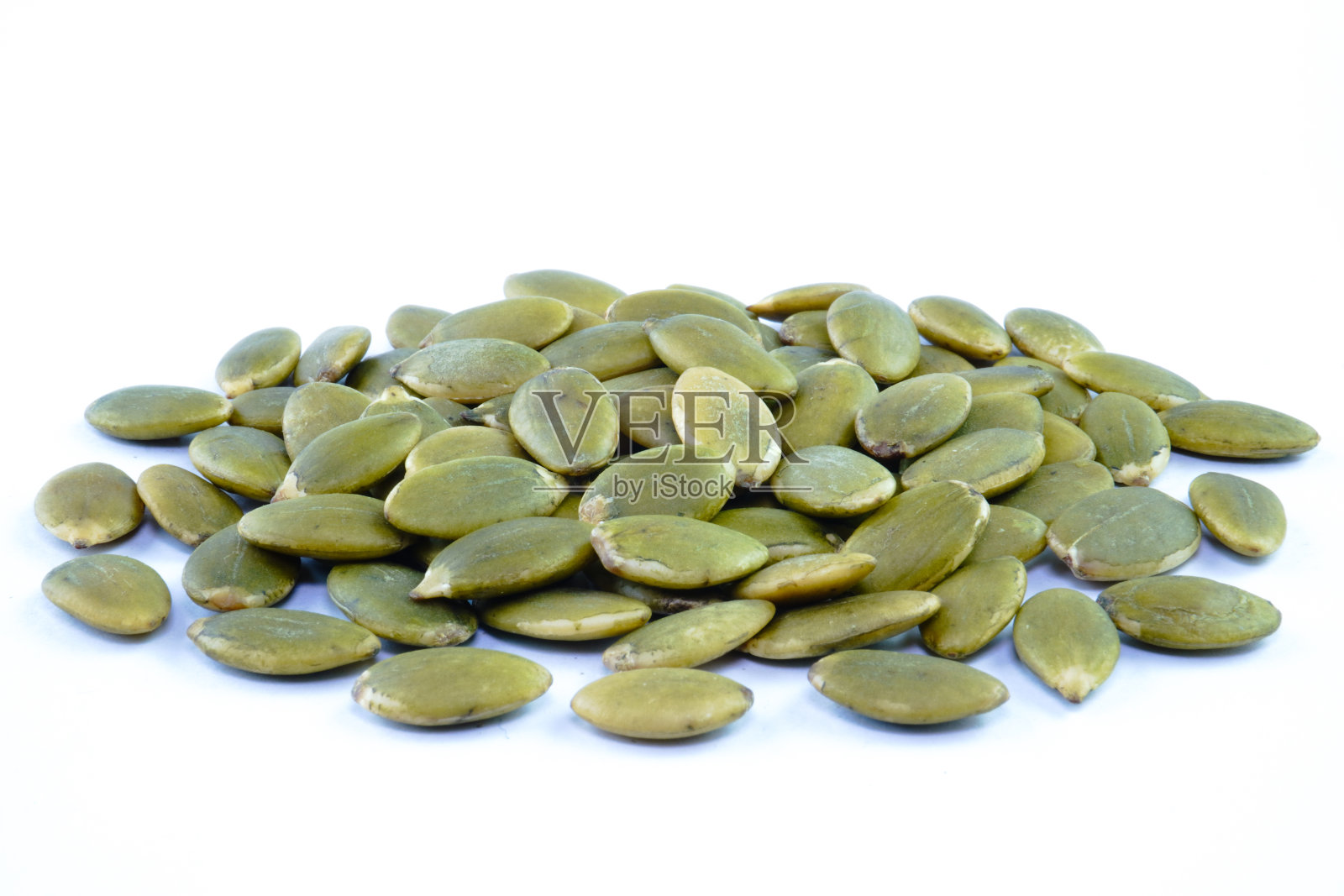 堆绿色南瓜籽的概念背景照片摄影图片